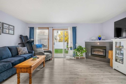 147 Somervale Park Sw, Calgary, AB - Indoor Photo Showing Living Room With Fireplace