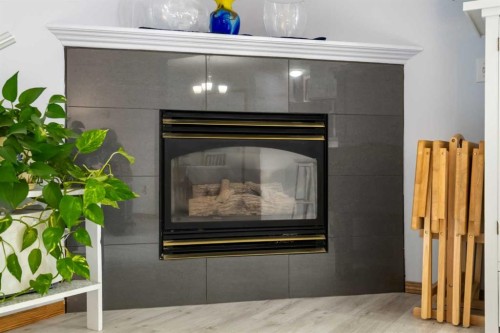 147 Somervale Park Sw, Calgary, AB - Indoor Photo Showing Living Room With Fireplace
