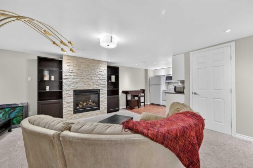 920 42 Street Sw, Calgary, AB - Indoor Photo Showing Living Room With Fireplace