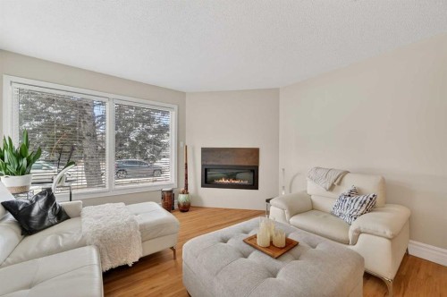 920 42 Street Sw, Calgary, AB - Indoor Photo Showing Living Room With Fireplace