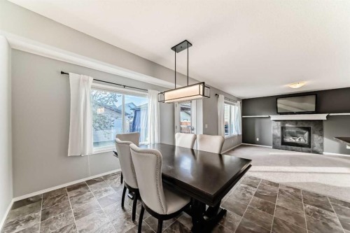 1809 Baywater Gardens Sw, Airdrie, AB - Indoor With Fireplace