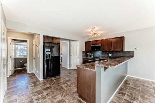 1809 Baywater Gardens Sw, Airdrie, AB - Indoor Photo Showing Kitchen