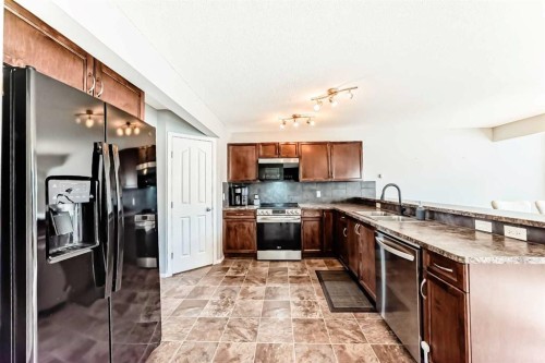 1809 Baywater Gardens Sw, Airdrie, AB - Indoor Photo Showing Kitchen With Double Sink