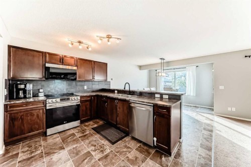 1809 Baywater Gardens Sw, Airdrie, AB - Indoor Photo Showing Kitchen