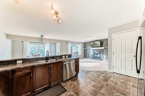 1809 Baywater Gardens Sw, Airdrie, AB - Indoor Photo Showing Kitchen With Double Sink