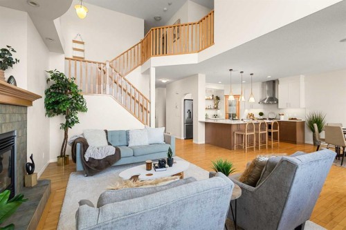511 Cresthaven Place Sw, Calgary, AB - Indoor Photo Showing Living Room With Fireplace