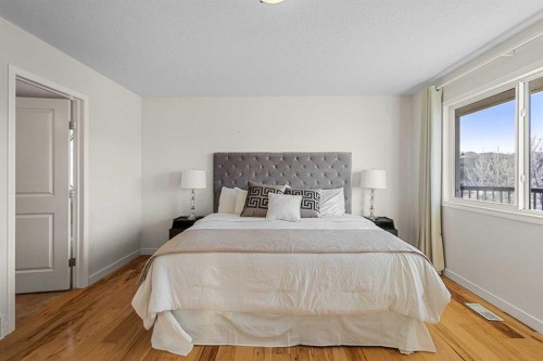 511 Cresthaven Place Sw, Calgary, AB - Indoor Photo Showing Bedroom