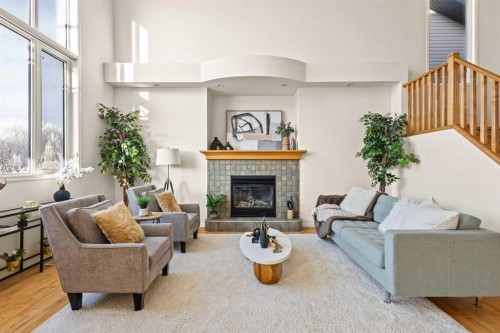 511 Cresthaven Place Sw, Calgary, AB - Indoor Photo Showing Living Room With Fireplace