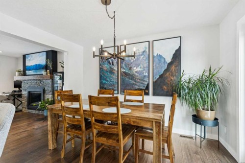 169 Braniff Crescent Sw, Calgary, AB - Indoor Photo Showing Dining Room With Fireplace