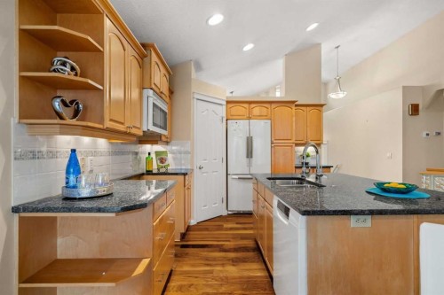 154 Bridlecreek Park Sw, Calgary, AB - Indoor Photo Showing Kitchen With Double Sink With Upgraded Kitchen