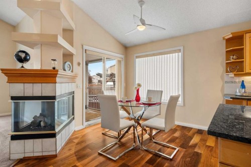 154 Bridlecreek Park Sw, Calgary, AB - Indoor Photo Showing Other Room With Fireplace