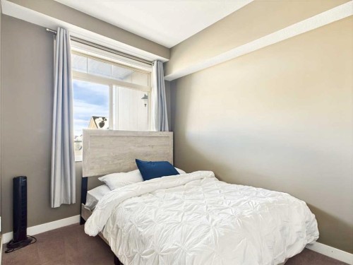305-28 Auburn Bay Link Se, Calgary, AB - Indoor Photo Showing Bedroom