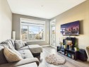 305-28 Auburn Bay Link Se, Calgary, AB  - Indoor Photo Showing Living Room 