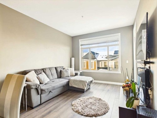 305-28 Auburn Bay Link Se, Calgary, AB - Indoor Photo Showing Living Room