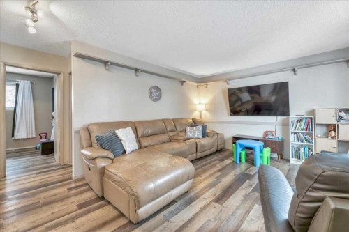 128 Thornburn Road, Strathmore, AB - Indoor Photo Showing Living Room With Fireplace
