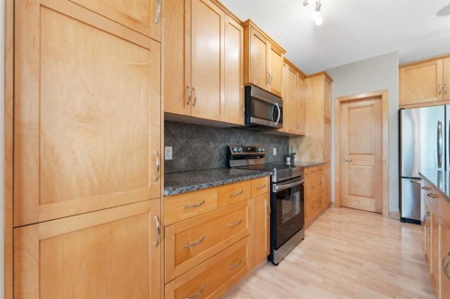 155 Autumn Close Se, Calgary, AB - Indoor Photo Showing Kitchen With Stainless Steel Kitchen