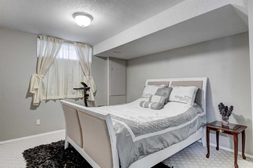 1121 Sierra Morena Court Sw, Calgary, AB - Indoor Photo Showing Bedroom