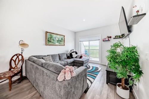 1703 Jumping Pound Common, Cochrane, AB - Indoor Photo Showing Living Room