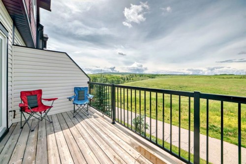 1703 Jumping Pound Common, Cochrane, AB - Outdoor With Deck Patio Veranda With Exterior