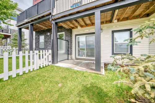 1703 Jumping Pound Common, Cochrane, AB - Outdoor With Deck Patio Veranda With Exterior