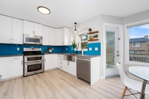 103 Sunset Place, Okotoks, AB - Indoor Photo Showing Kitchen With Stainless Steel Kitchen