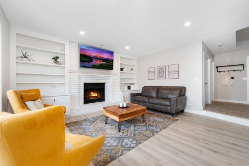 103 Sunset Place, Okotoks, AB - Indoor Photo Showing Living Room With Fireplace