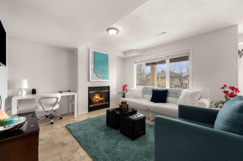 21 Cresthaven Way Sw, Calgary, AB - Indoor Photo Showing Living Room With Fireplace