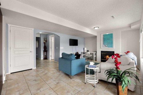 21 Cresthaven Way Sw, Calgary, AB - Indoor Photo Showing Living Room With Fireplace