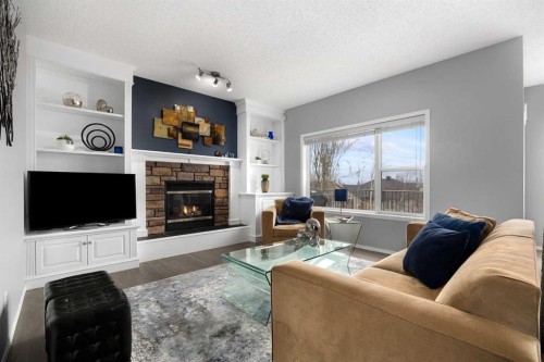 21 Cresthaven Way Sw, Calgary, AB - Indoor Photo Showing Living Room With Fireplace