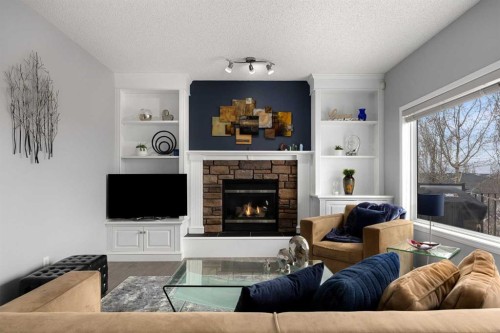 21 Cresthaven Way Sw, Calgary, AB - Indoor Photo Showing Living Room With Fireplace