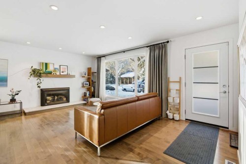 3449 Lane Crescent Sw, Calgary, AB - Indoor Photo Showing Living Room With Fireplace
