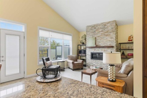 171 Evanswood Circle Nw, Calgary, AB - Indoor Photo Showing Living Room With Fireplace