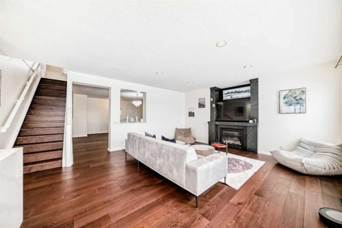 170 Panamount Road Nw, Calgary, AB - Indoor Photo Showing Living Room With Fireplace
