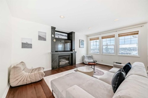 170 Panamount Road Nw, Calgary, AB - Indoor Photo Showing Living Room With Fireplace