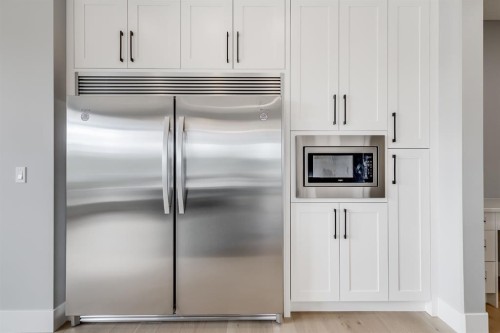 1209 Coopers Drive Sw, Airdrie, AB - Indoor Photo Showing Kitchen