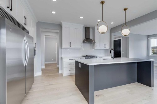 1209 Coopers Drive Sw, Airdrie, AB - Indoor Photo Showing Kitchen With Upgraded Kitchen