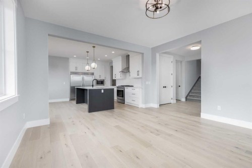 1209 Coopers Drive Sw, Airdrie, AB - Indoor Photo Showing Kitchen