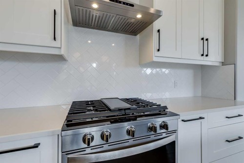 1209 Coopers Drive Sw, Airdrie, AB - Indoor Photo Showing Kitchen