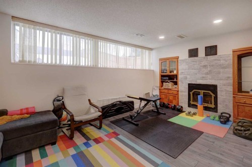 76 Ranchridge Drive Nw, Calgary, AB - Indoor With Fireplace
