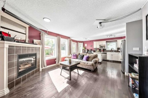 135 Westridge Close, Okotoks, AB - Indoor Photo Showing Living Room With Fireplace