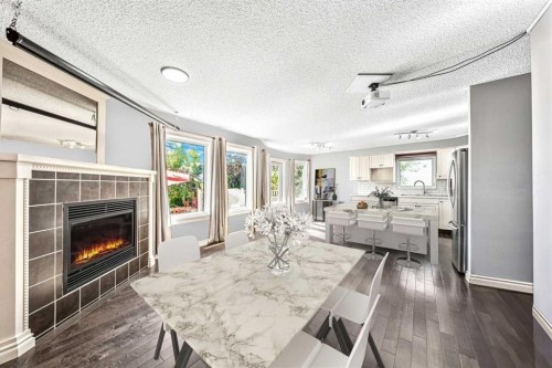 135 Westridge Close, Okotoks, AB - Indoor Photo Showing Living Room With Fireplace