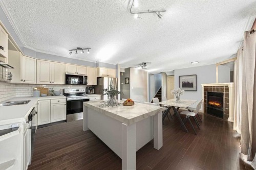 135 Westridge Close, Okotoks, AB - Indoor Photo Showing Kitchen With Stainless Steel Kitchen