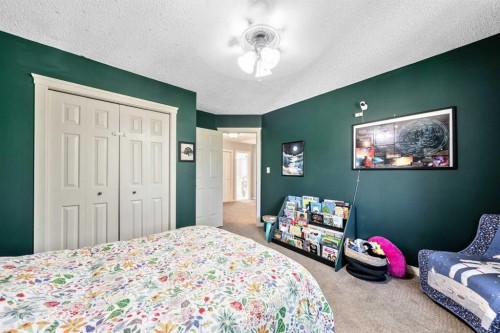 135 Westridge Close, Okotoks, AB - Indoor Photo Showing Bedroom
