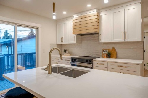 1024 Hunterston Place Nw, Calgary, AB - Indoor Photo Showing Kitchen With Stainless Steel Kitchen With Double Sink With Upgraded Kitchen