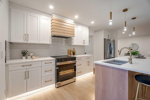 1024 Hunterston Place Nw, Calgary, AB - Indoor Photo Showing Kitchen With Double Sink With Upgraded Kitchen