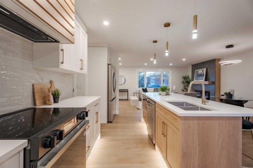 1024 Hunterston Place Nw, Calgary, AB - Indoor Photo Showing Kitchen With Double Sink With Upgraded Kitchen