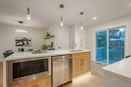 1024 Hunterston Place Nw, Calgary, AB - Indoor Photo Showing Kitchen With Double Sink With Upgraded Kitchen