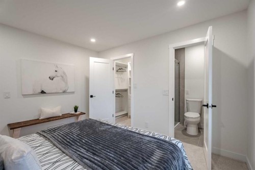 1024 Hunterston Place Nw, Calgary, AB - Indoor Photo Showing Bedroom