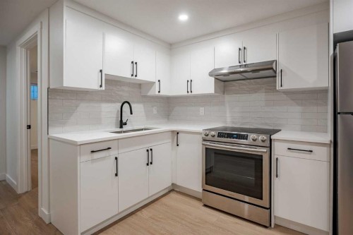 1024 Hunterston Place Nw, Calgary, AB - Indoor Photo Showing Kitchen With Stainless Steel Kitchen
