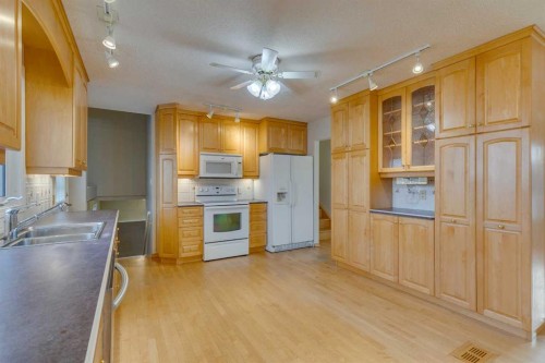 4 Lake Huron Place Se, Calgary, AB - Indoor Photo Showing Kitchen With Double Sink